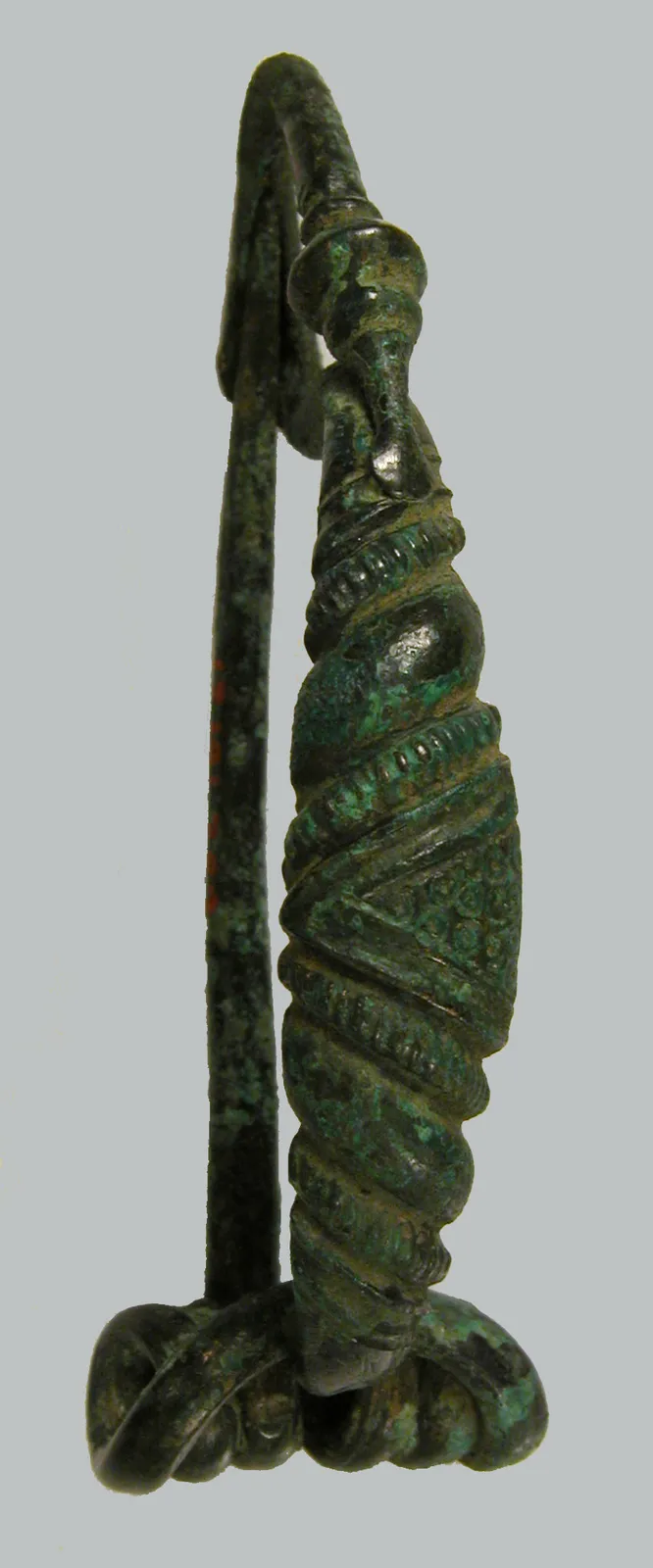 Cultural archive image of “Bow-Shaped Brooch”, catalogued as Celtic, dating to 4th century BCE. Medium: Copper alloy. Dimensions: Overall: 1/2 x 2 3/16 x 7/8 in.