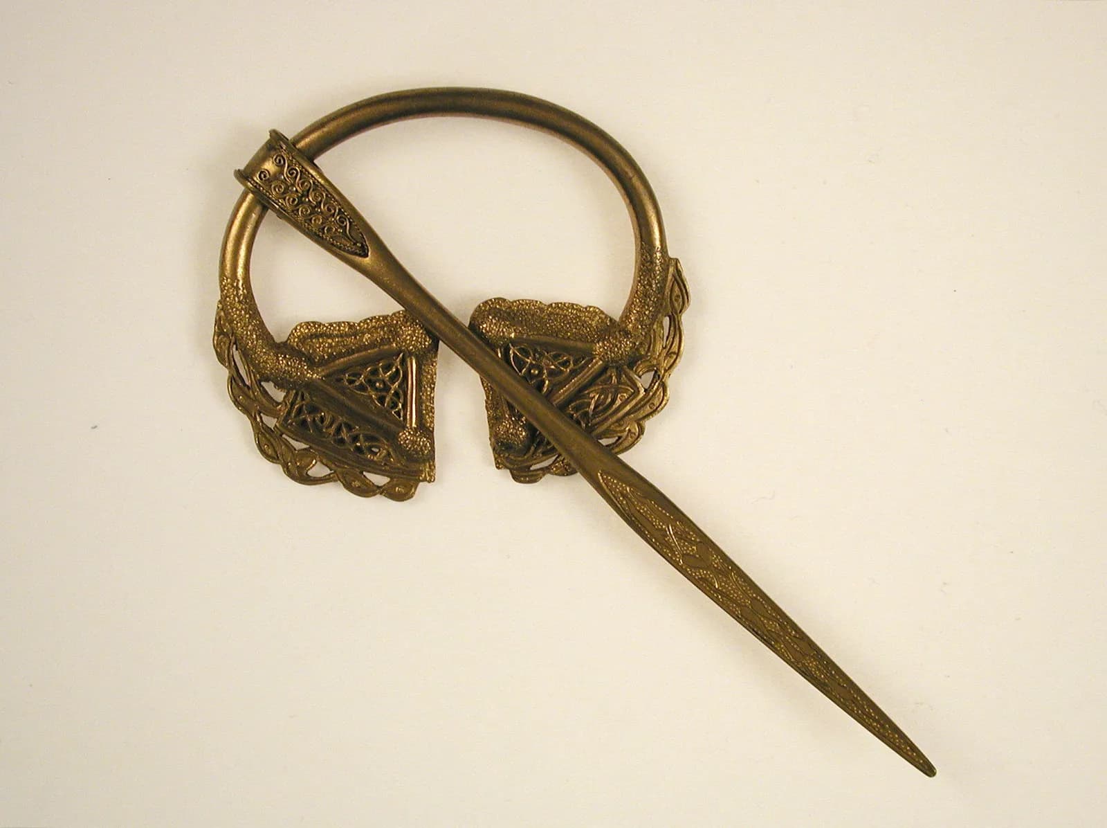 Cultural archive image of “Dalriada Brooch”, catalogued as Irish, dating to early 20th century (original dated 12th century). Medium: Gold. Dimensions: Diam: 2 15/16 in.