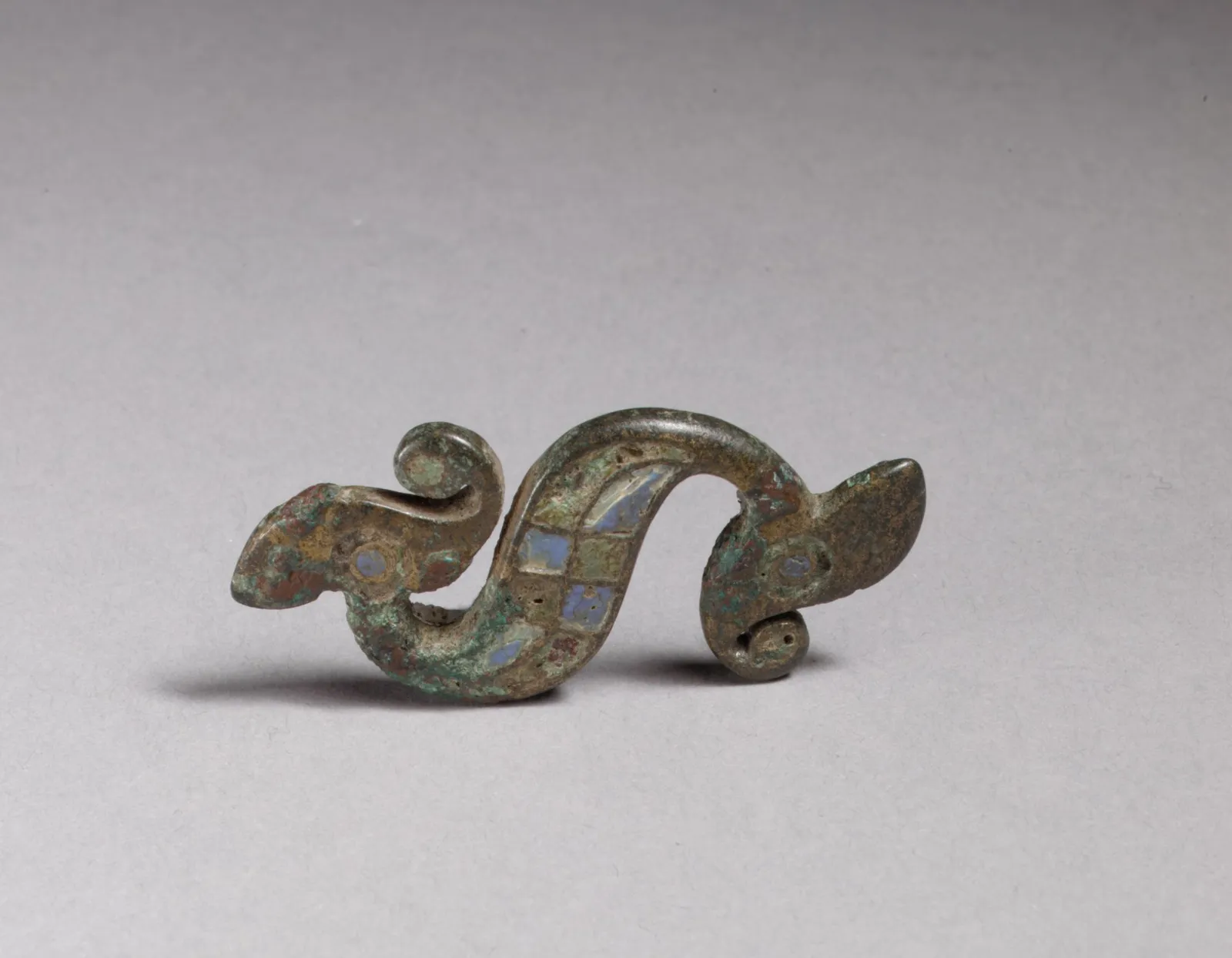 Cultural archive image of “Dragon-Shaped Brooch”, catalogued as Celtic or Roman, dating to 100–300. Medium: Copper alloy with champlevé enamel.