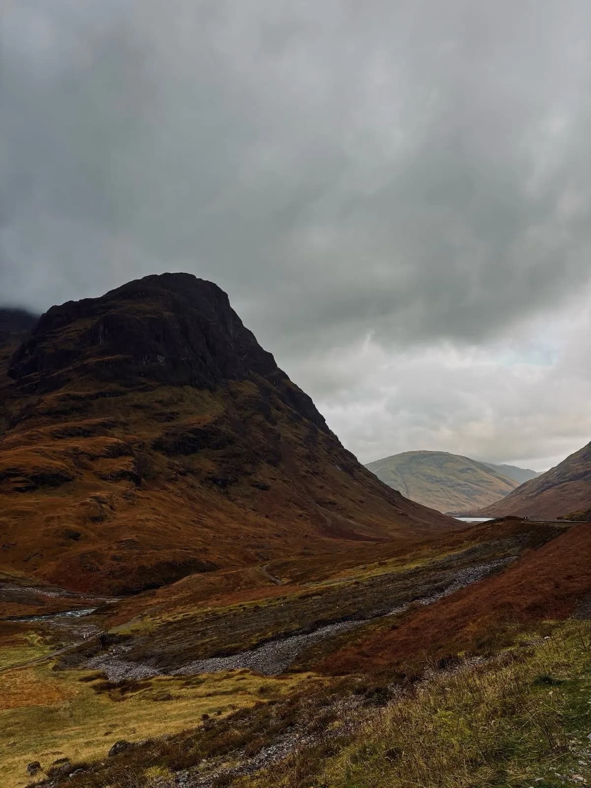 Cultural archive image of “Glencoe is a narrow valley in the western Highlands carved by glaciers from volcanic ro…”, associated with Highlands.