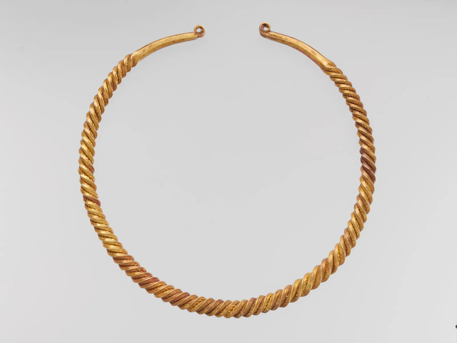 Cultural archive image of “Gold Neck Ring”, catalogued as Celtic, dating to 6th–4th century BCE, associated with Southern Russia or Black Sea Region (?). Medium: Gold. Dimensions: Overall: 7 1/2 x 7 1/2 x 1/2 in., 1.102lb.