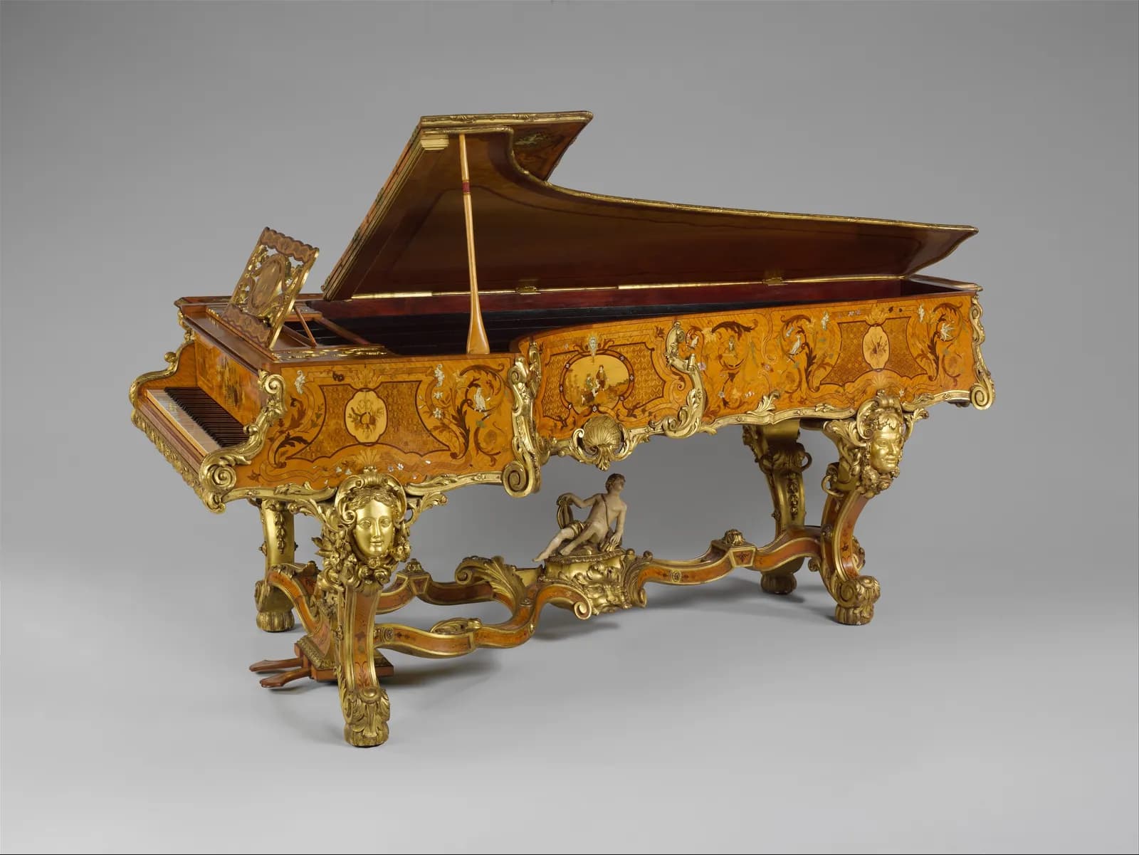 Cultural archive image of “Grand Pianoforte”, catalogued as British, dating to ca. 1840, associated with London, England, United Kingdom. Medium: Satinwood veneer, oak, spruce, iron, steel, ebony, ivory, gilding, mother-of-pearl, holly,…