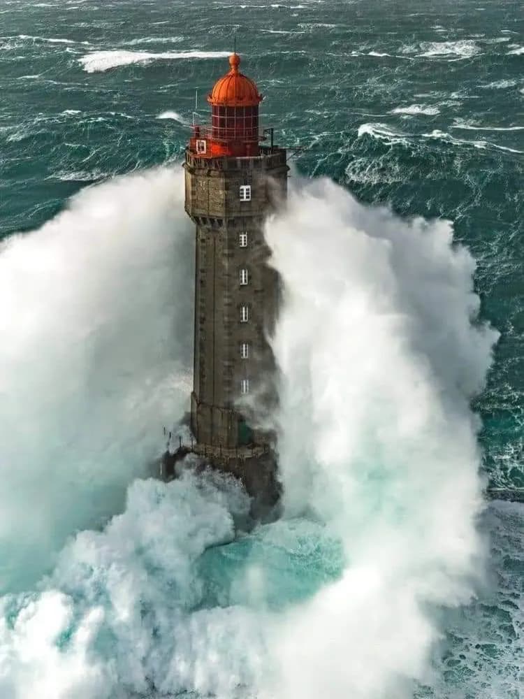 Cultural archive image of “La Jument is a lighthouse standing on a rock off the western tip of the island of Ushan…”, associated with Finistère.