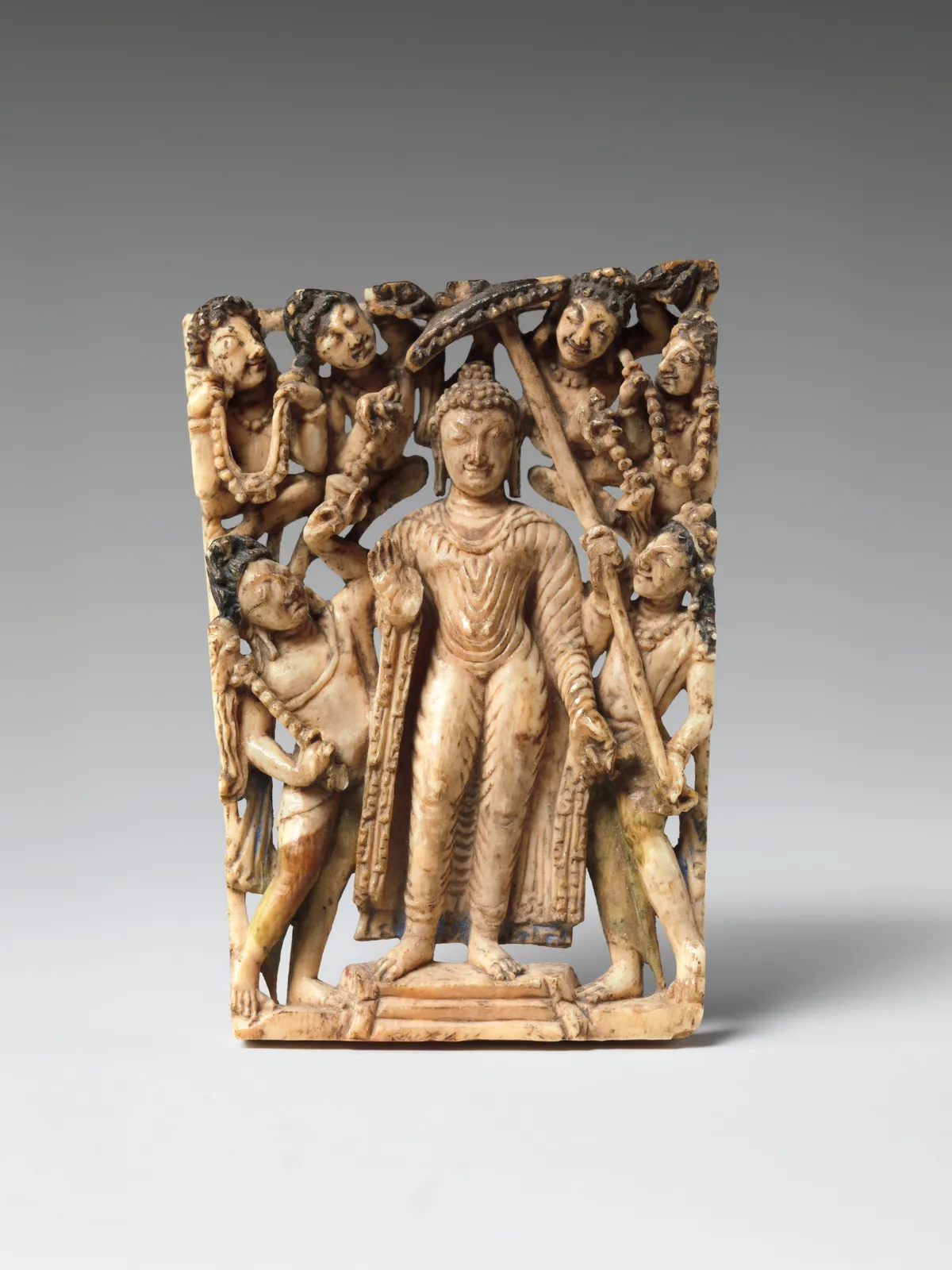 Cultural archive image of “Panel from a Portable Shrine: The Descent of the Buddha from Trayastrimsha Heaven”, catalogued as India (Jammu and Kashmir, ancient kingdom of Kashmir),, dating to 7th–8th century. Medium: Ivory with traces of…