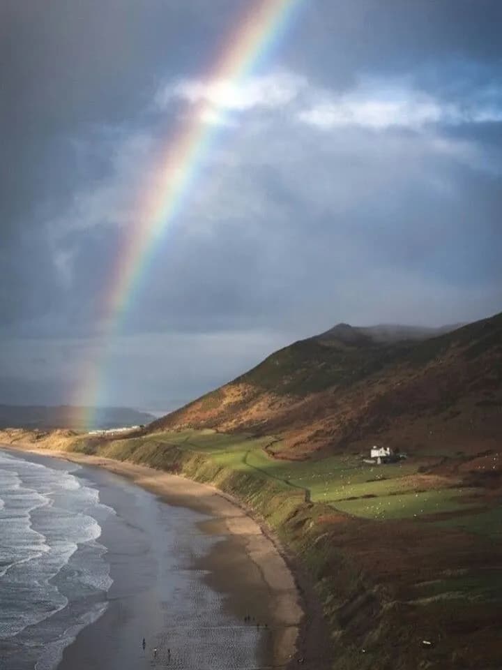 Cultural archive image of “Rhossili Bay is three miles of sand on the western tip of the Gower Peninsula in south…”, associated with Gower.
