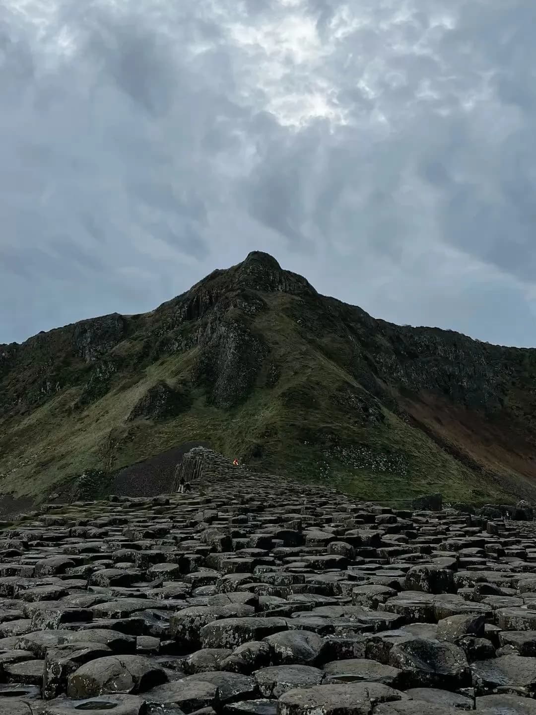 Cultural archive image of “The Giant’s Causeway is about 40,000 interlocking basalt columns on the Antrim coast, f…”, associated with Antrim Coast.